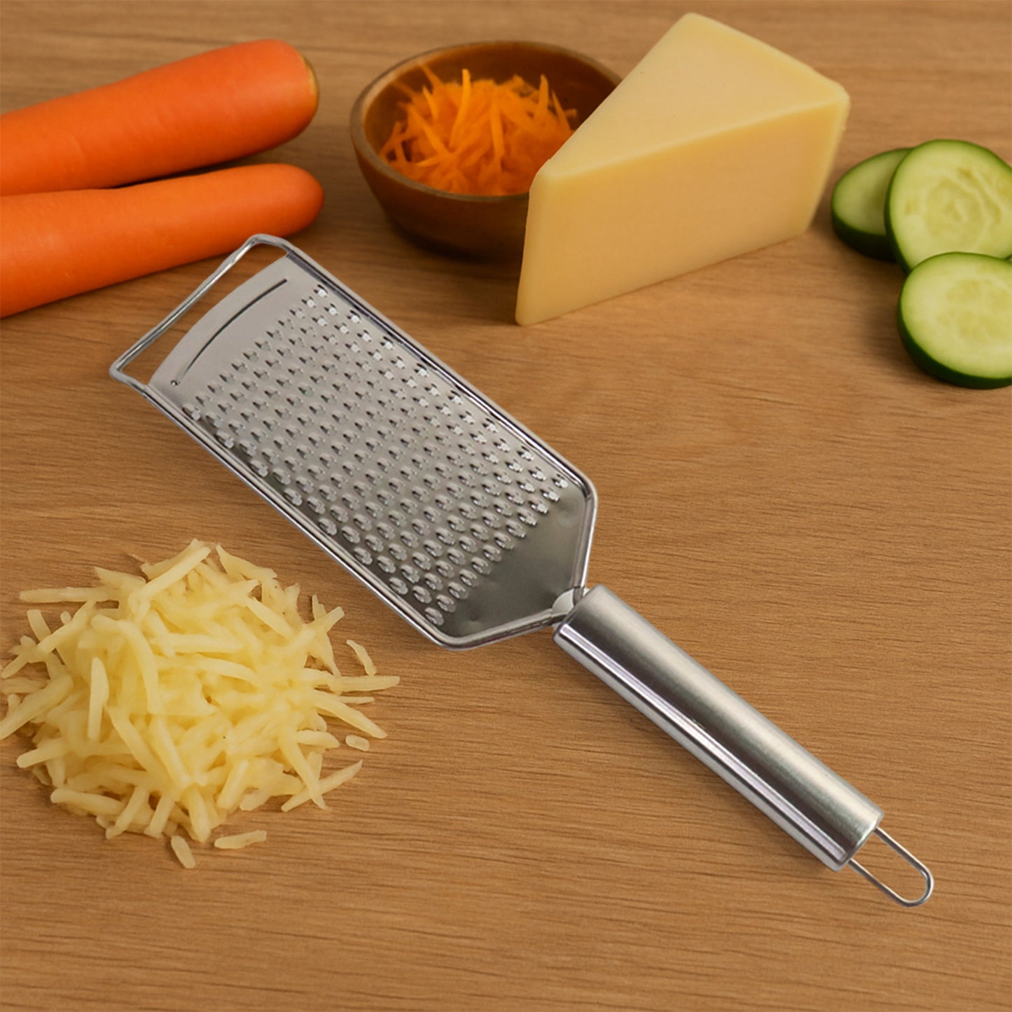 Wukusy Supermom stainless steel carrot grater for kitchen use, featuring a durable, four-sided design for versatile vegetable grating.