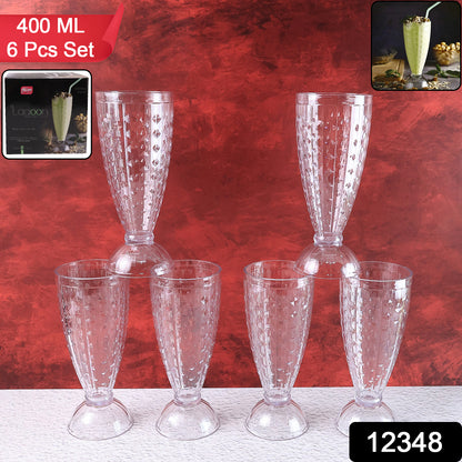 Six transparent plastic milkshake glasses by Wukusy, 400ml capacity, arranged on a kitchen countertop.