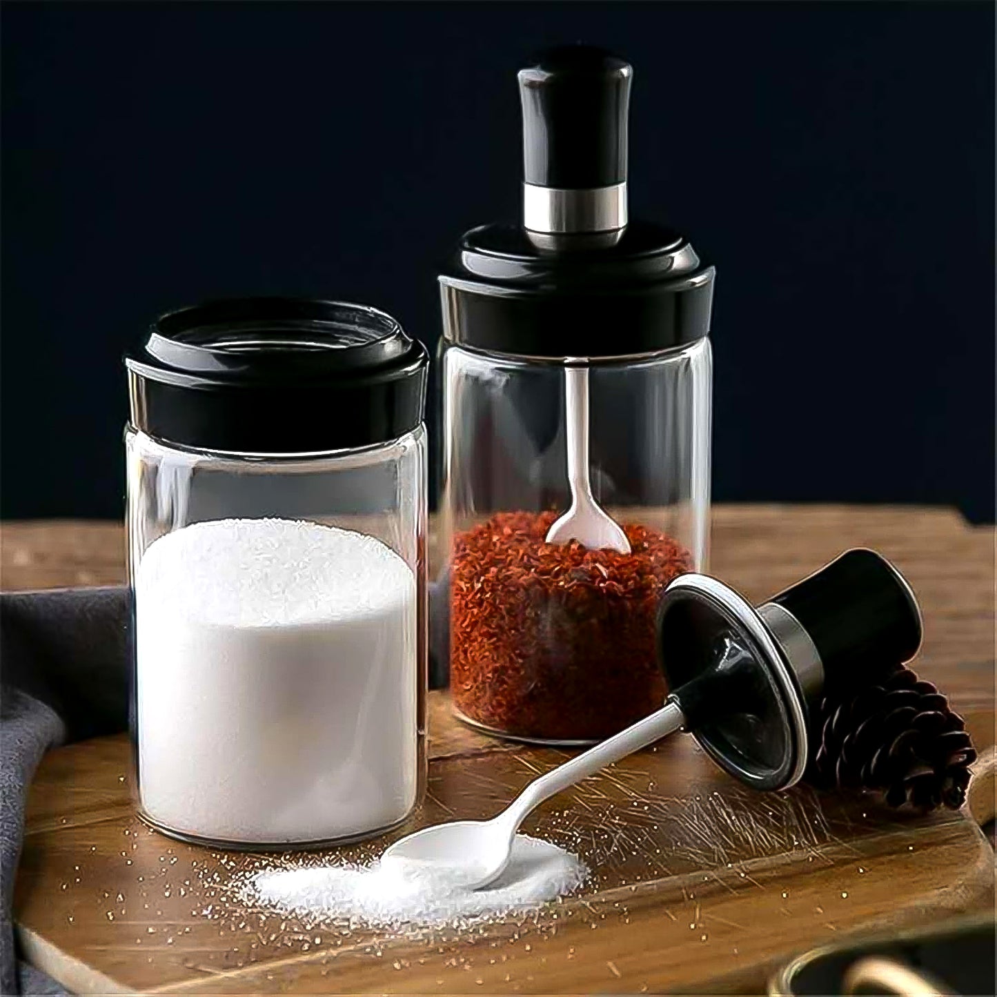 Transparent glass storage jar with built-in spoon from Wukusy, 250ml capacity, ideal for kitchen storage and organization.