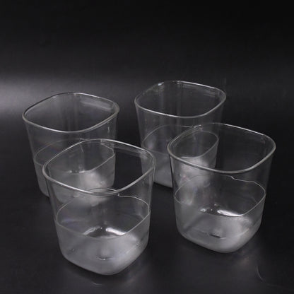 Set of four transparent Wukusy plastic jugs with elegant handles, each approximately 2000 ml, for home and kitchen use.