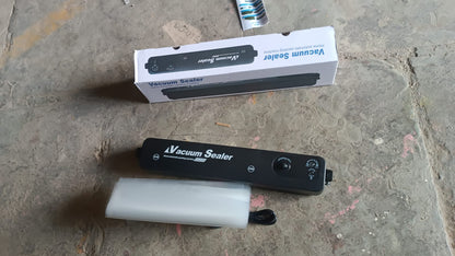 Wukusy vacuum sealer machine with 10 sealing bags for home kitchen use, shown on a countertop in a modern kitchen setting.