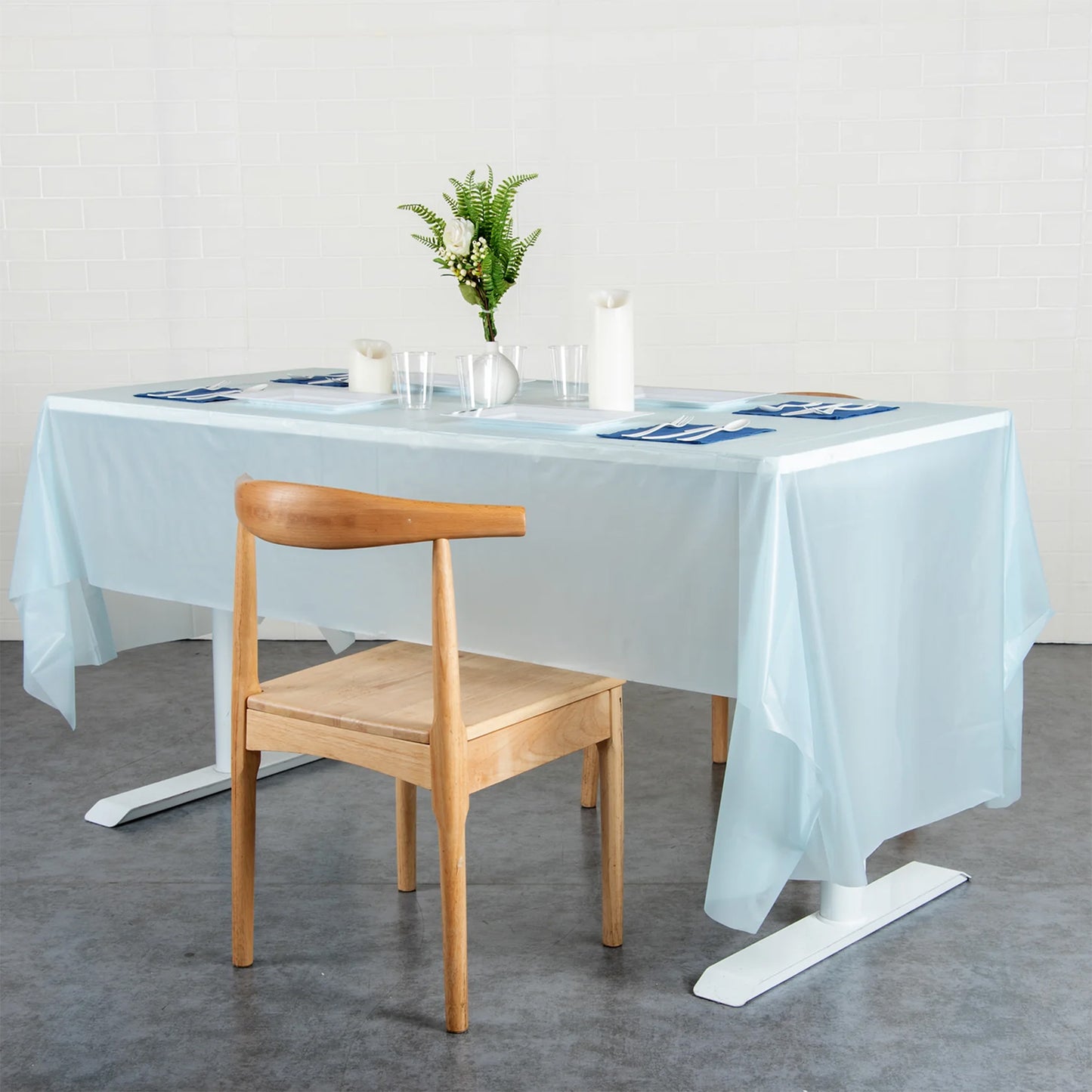 Waterproof disposable plastic table cover by Wukusy, 137x183 cm, ideal for home and kitchen use, protecting surfaces from spills.