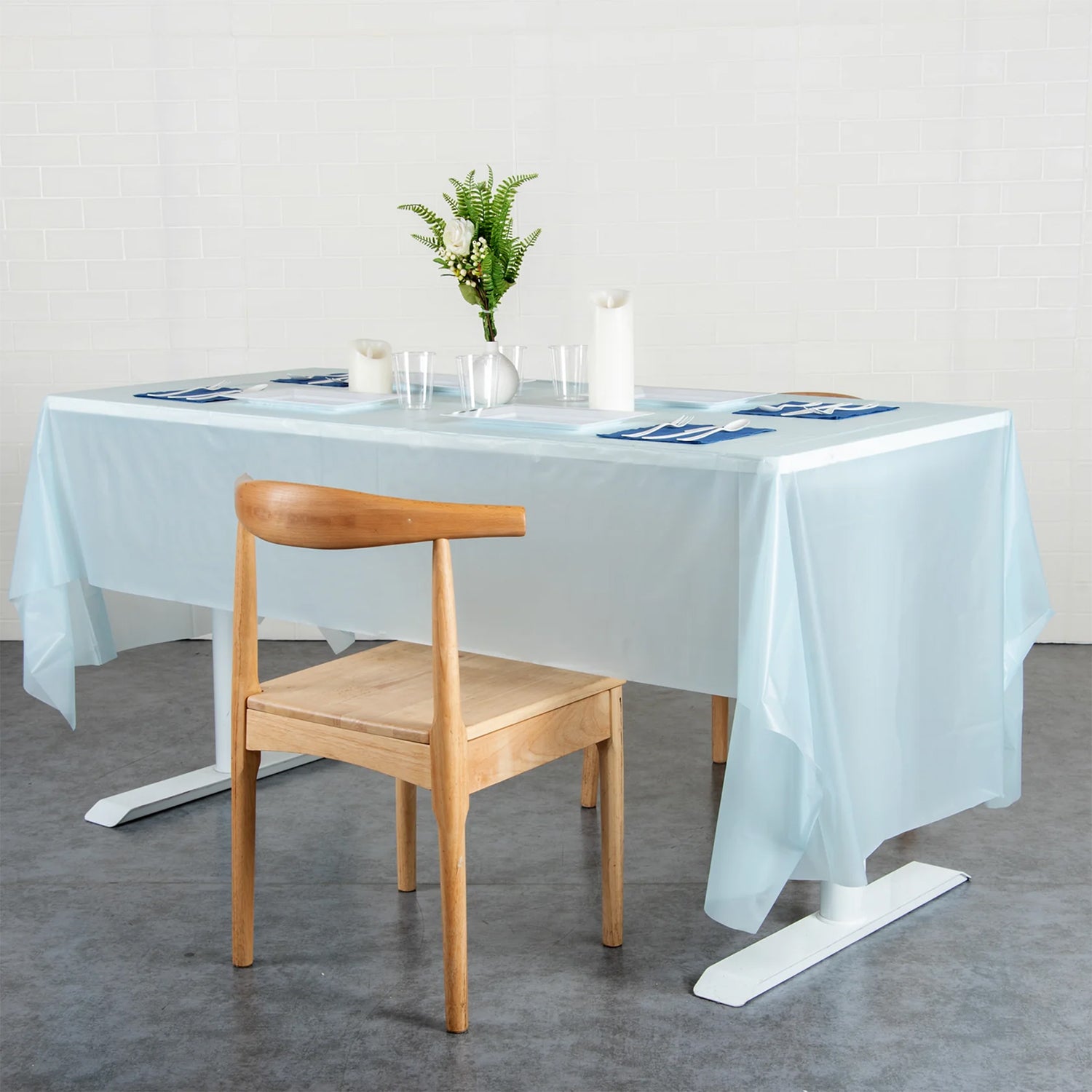 Waterproof disposable plastic table cover by Wukusy, 137x183 cm, ideal for home and kitchen use, protecting surfaces from spills.