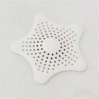 White silicone star-shaped sink filter by Wukusy, bathroom hair catcher and drain strainer for basin, prevents clogs and debris.