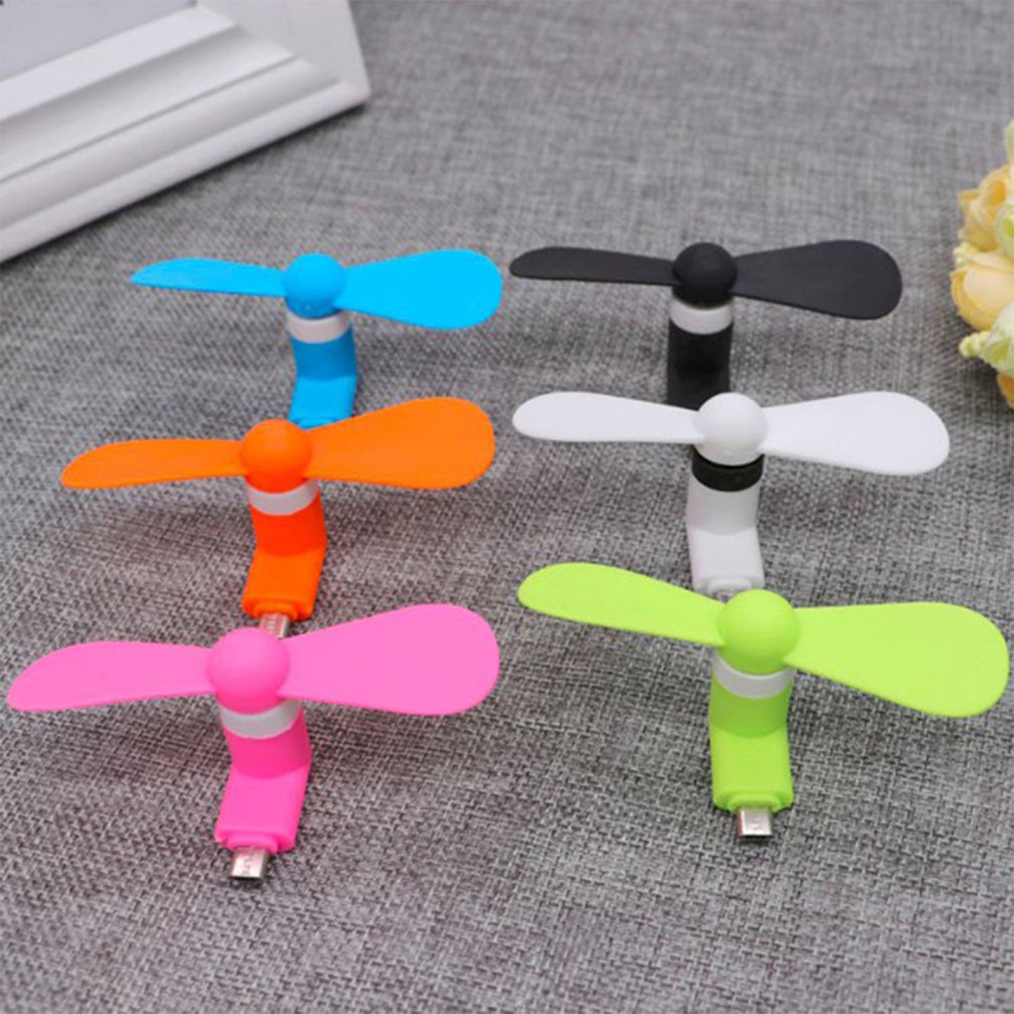 Kids Wukusy 6183 Mini USB Fan providing cool air instantly, portable and compact for on-the-go cooling.