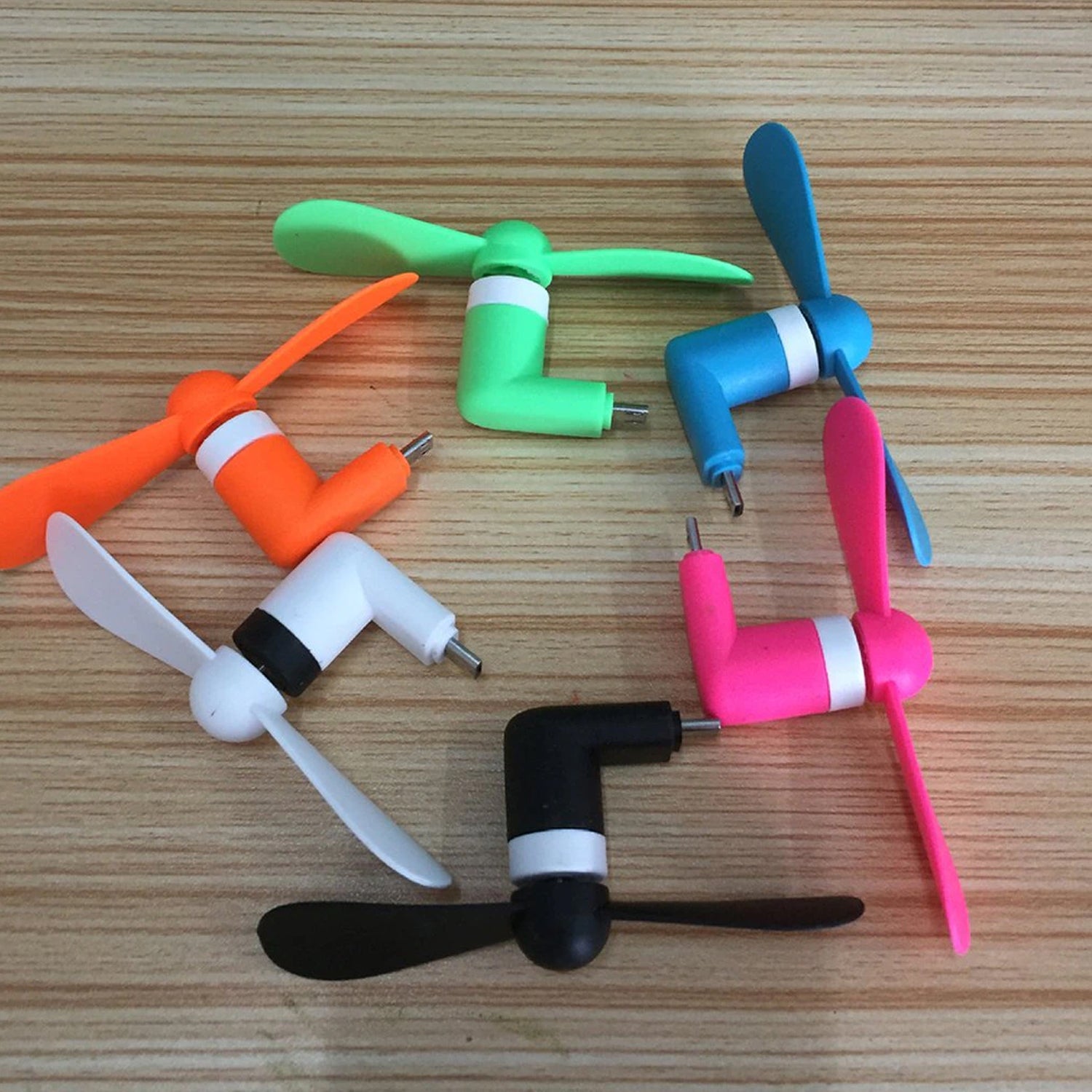 Wukusy kids mini USB fan providing cool air, ideal for portable use anywhere and anytime.