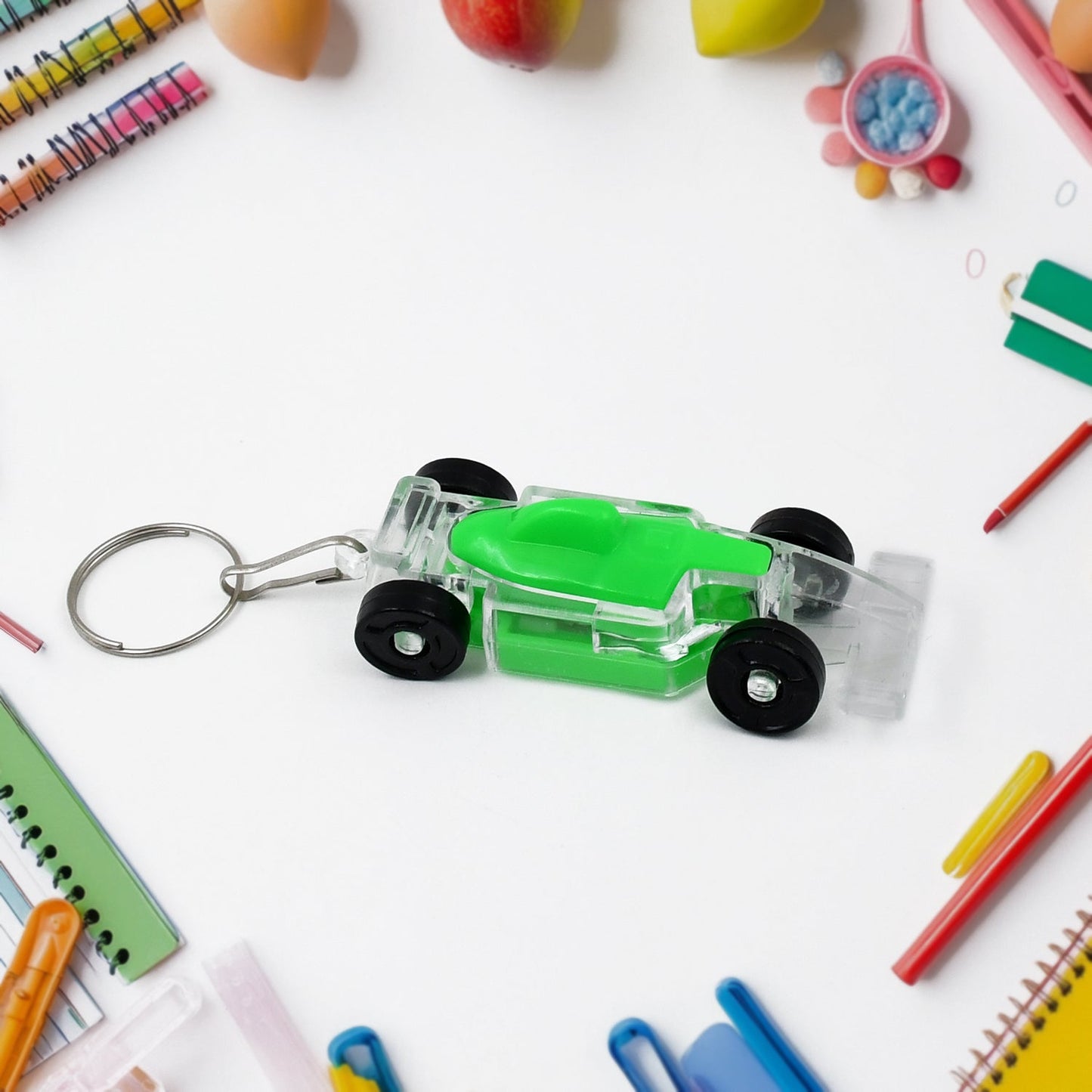 Kids' Wukusy car-shaped keychain with on/off button and flashing LED light, featuring a playful design and durable plastic material.