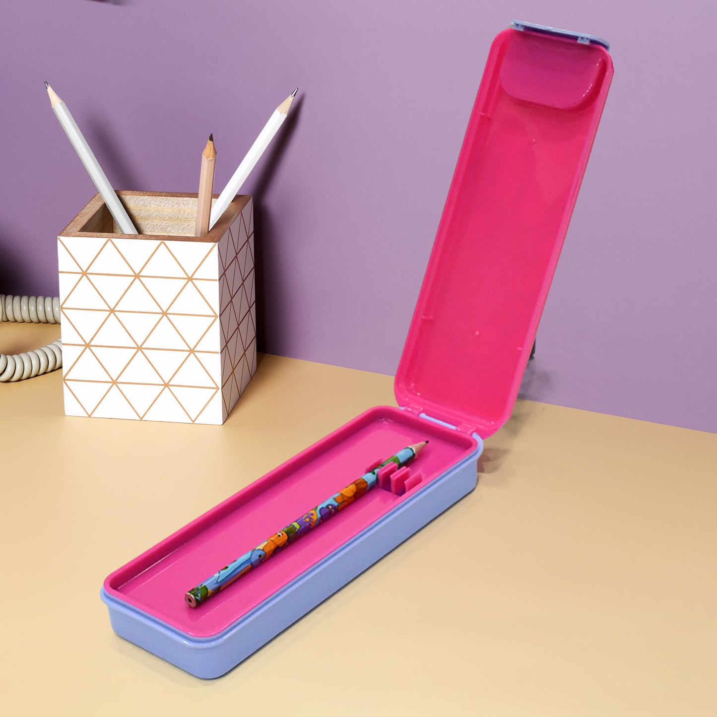 Wukusy kids' cartoon printed hard top pencil box with mixed designs, durable case for storing pencils and stationery.
