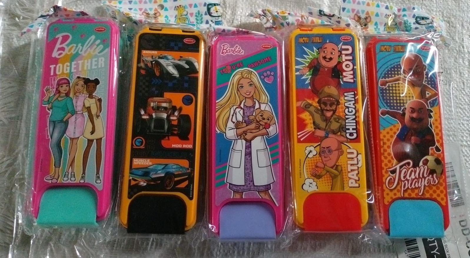 Wukusy kids cartoon printed hard top pencil box with colorful mix designs, ideal for school supplies and organization.