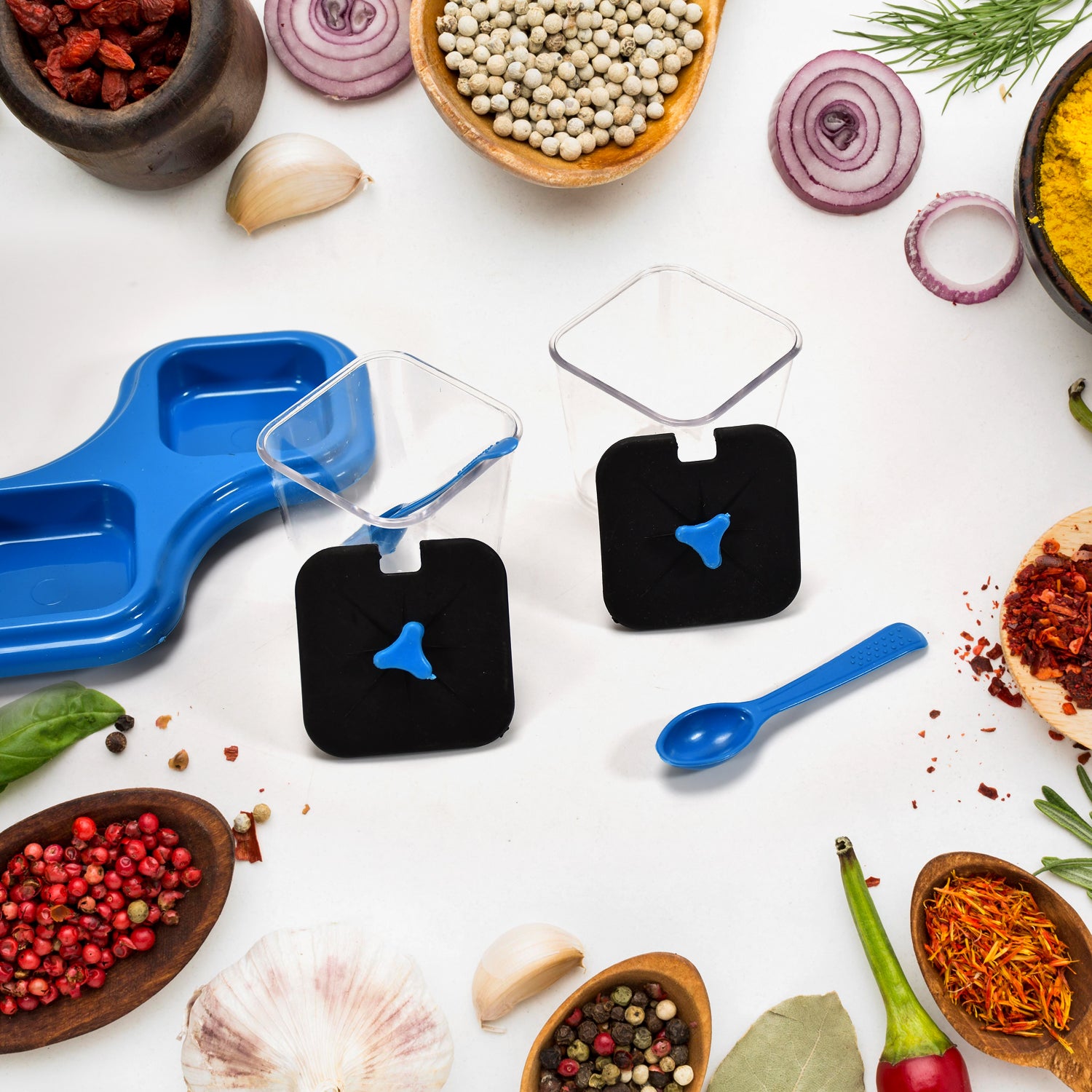 Wukusy kitchen tool set includes two plastic dining table stands with spice jars, pickle jars, and serving spoons for salt, pepper, and sauces.