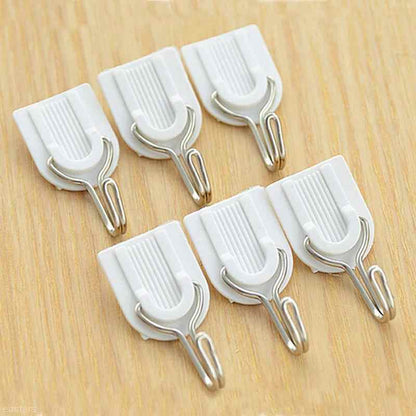 Wukusy adhesive ABS plastic hook towel hanger for kitchen and bathroom, mounted on a wall for hanging towels and kitchen tools.