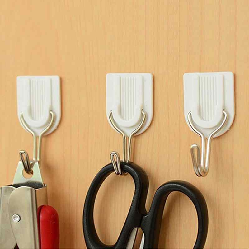 Wukusy 1627 adhesive ABS plastic hook towel hanger for kitchen or bathroom, attached to wall for towel or accessory hanging.