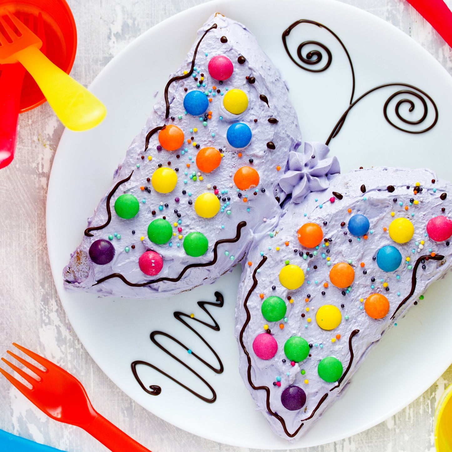 Set of four Wukusy butterfly-shaped silicone cake cup liners for muffins, cupcakes, soap, and baking, oven and microwave safe.