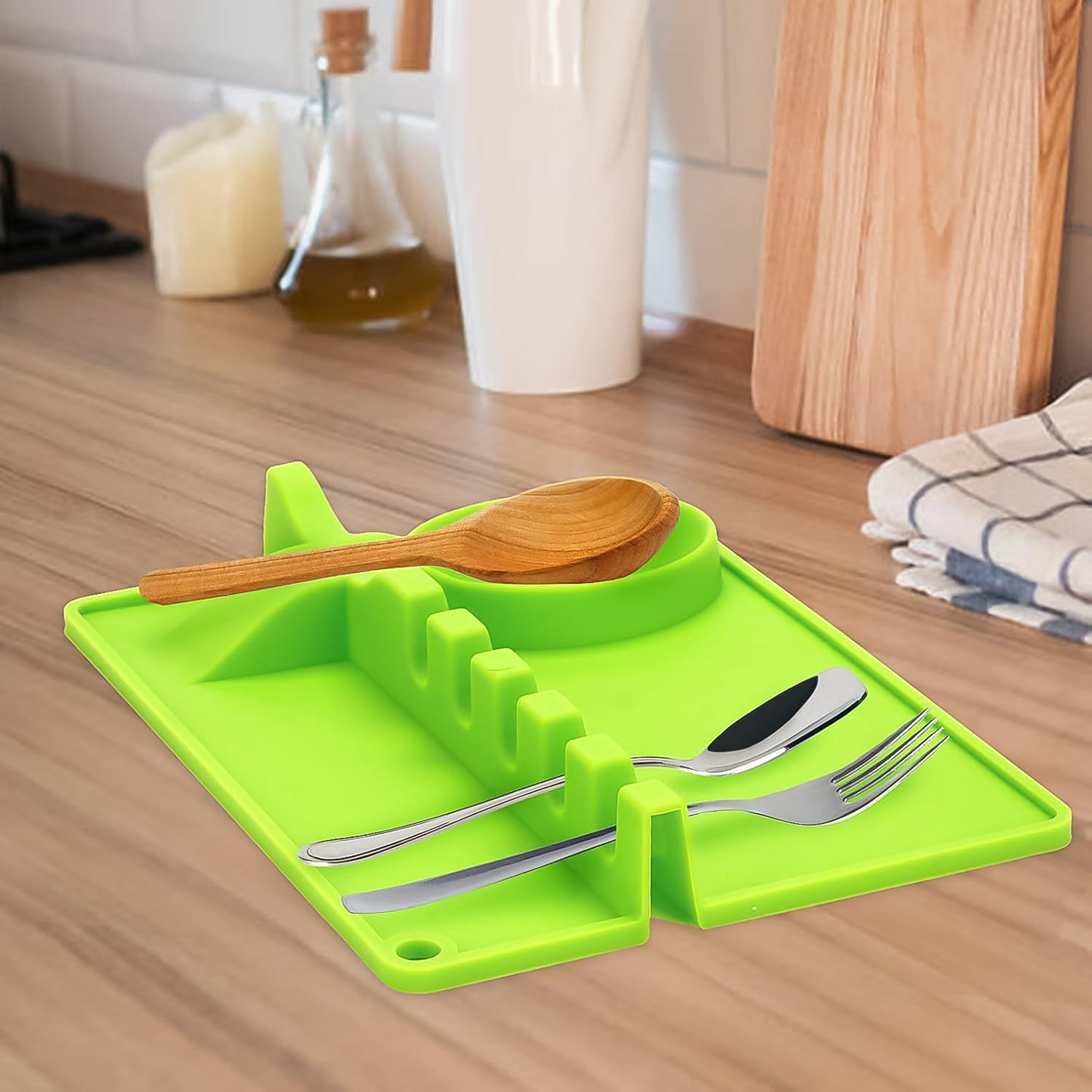 Wukusy 4-slots silicone kitchen utensil holder with slots for spoons, forks, and spatulas, versatile and heat-resistant.