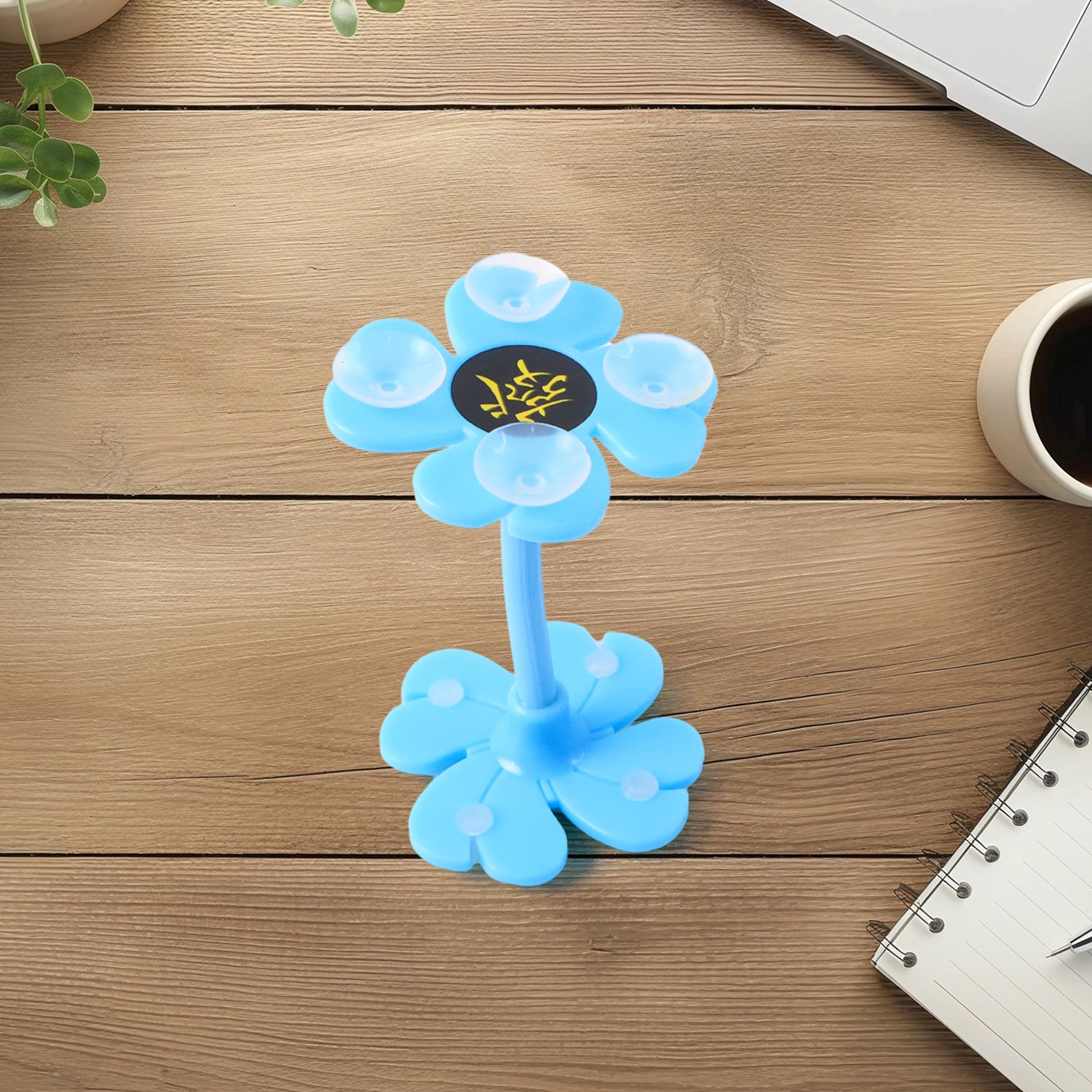 Multicolored Wukusy 360° rotatable flower-shaped cellphone holder car mount with sucker stand and packaging.