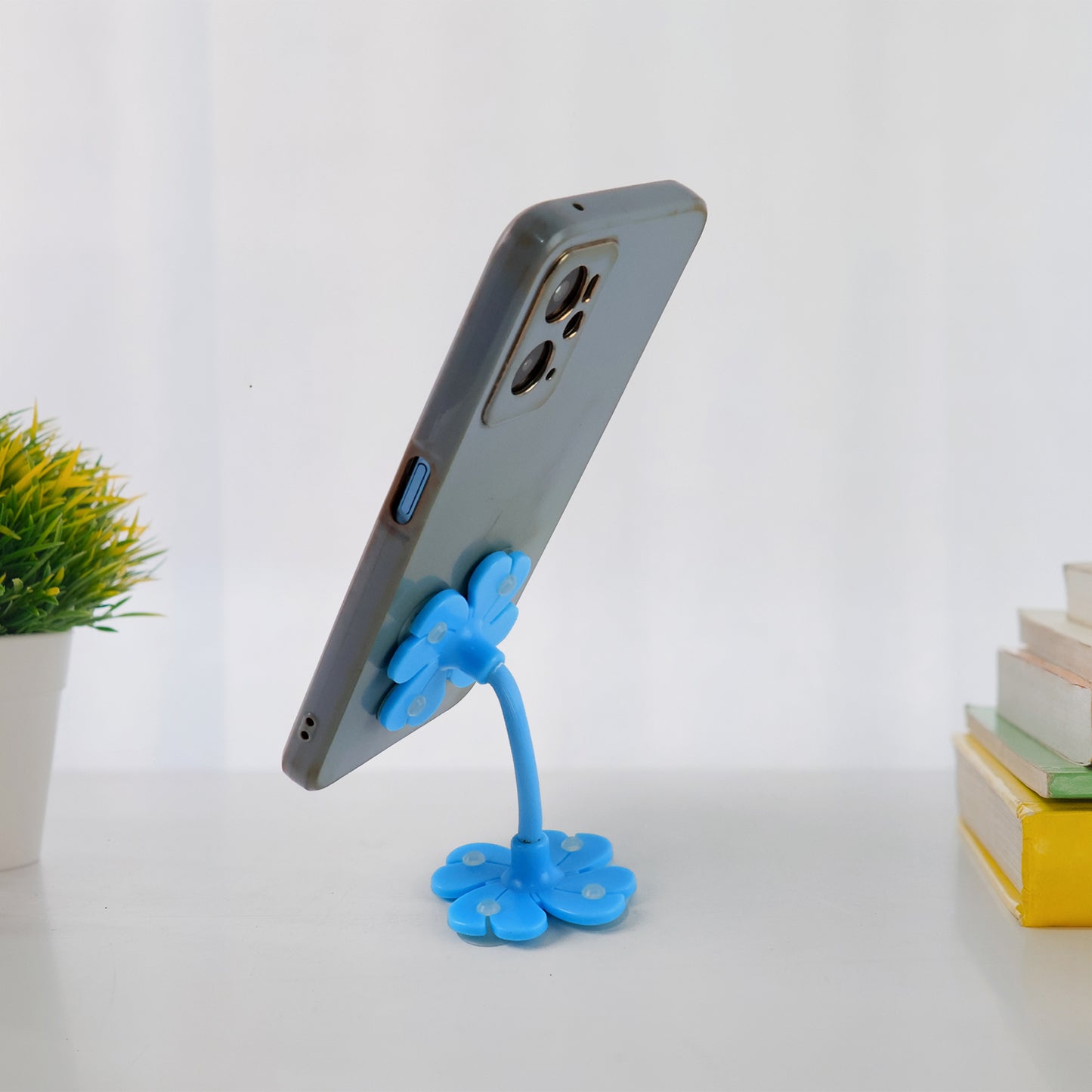 Wukusy 360° rotatable flower-shaped cellphone holder car mount with multicolored design and suction cup stand.