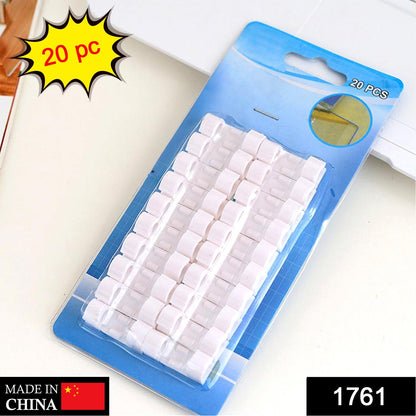 Wukusy 1761 self-adhesive cable clips for wire management, round plastic holder for mobile accessories and cable organization.