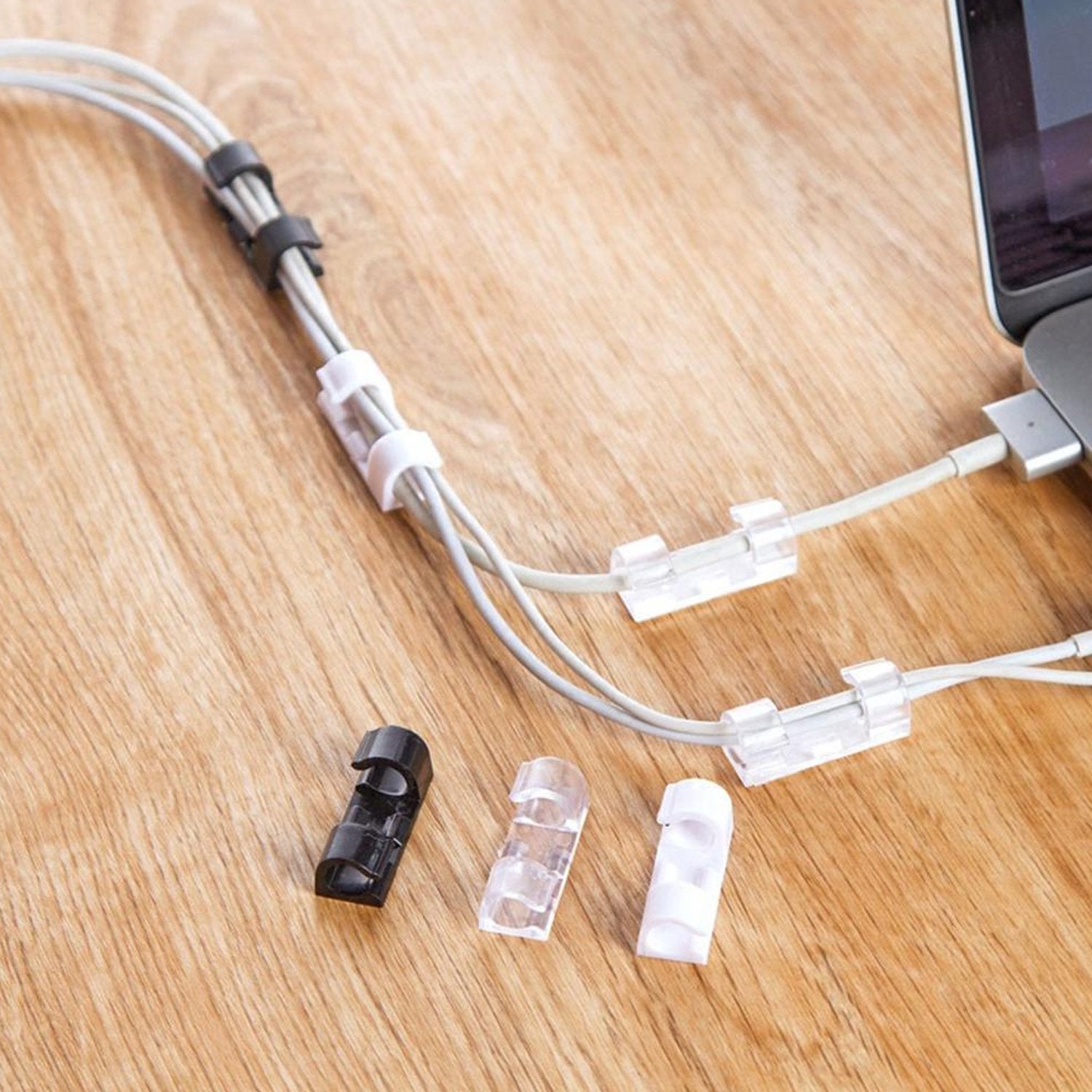 Wukusy 1761 self-adhesive cable clips for wire management, round plastic holder for mobile accessories and cable cords.