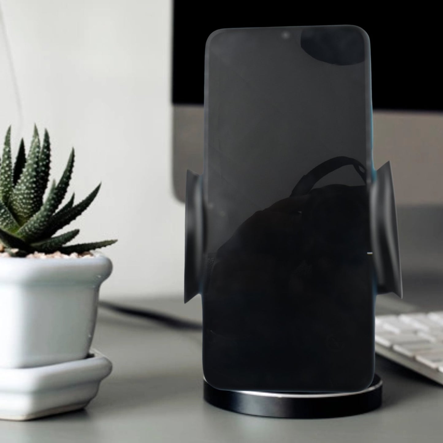 Wukusy 7316 car vent mobile holder holding a smartphone, compact and easy to install car accessory for secure smartphone mounting.