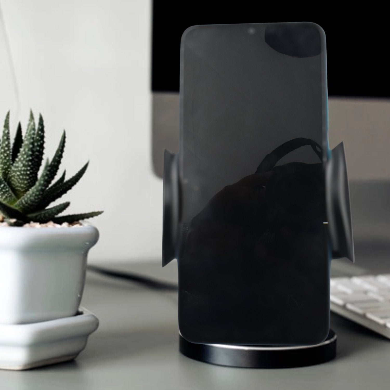 Wukusy 7316 car vent mobile holder holding a smartphone, compact and easy to install car accessory for secure smartphone mounting.