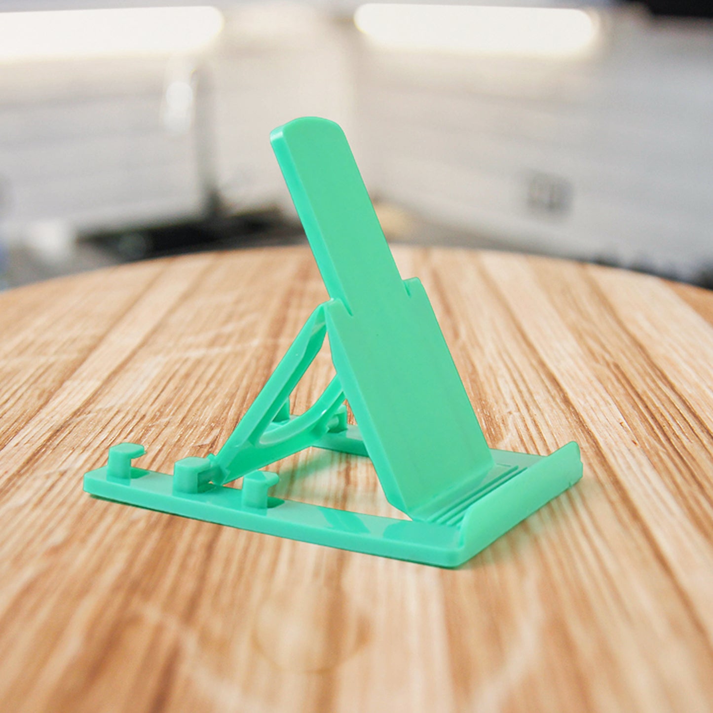 Two Wukusy adjustable foldable plastic mobile phone stands on a white background, showcasing their compact and portable design.
