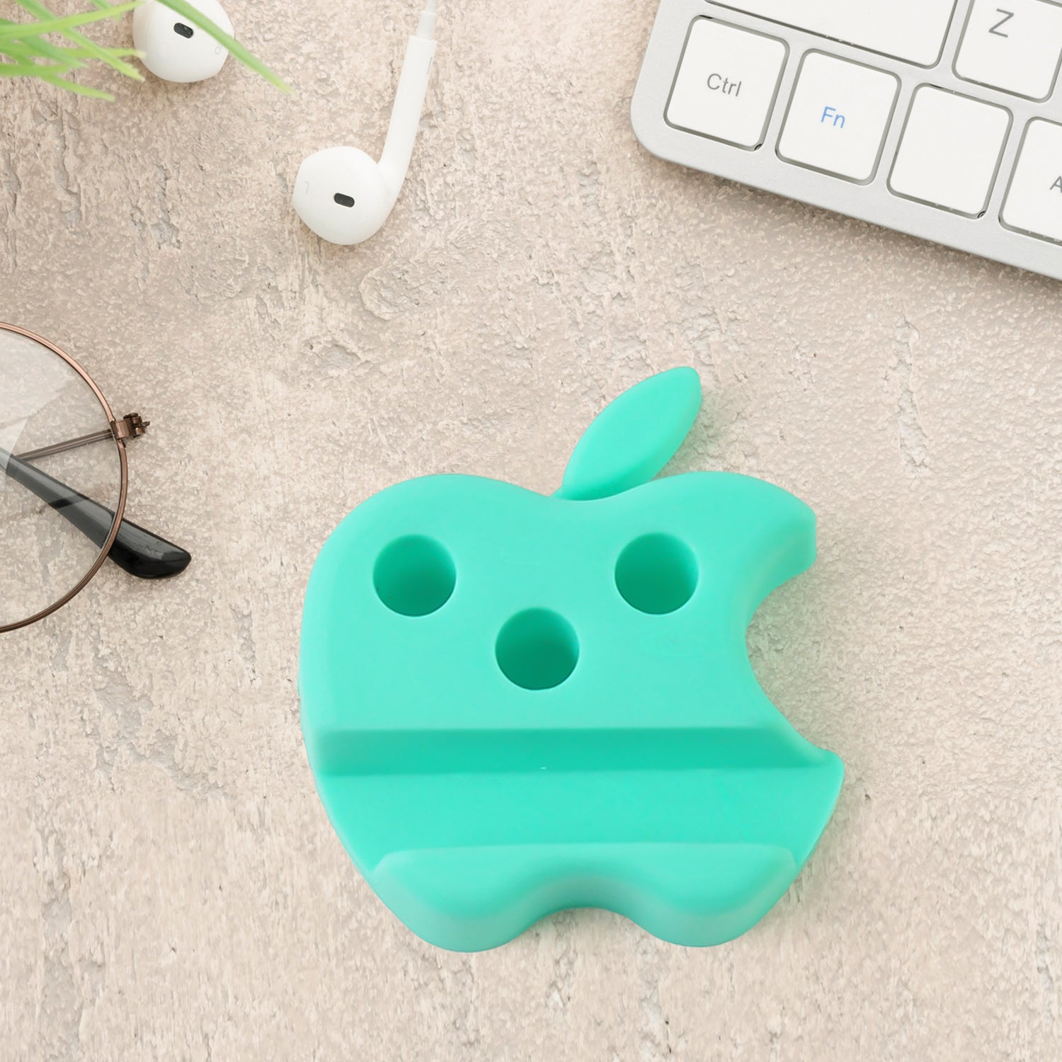 Set of three Wukusy apple-shaped plastic mobile stands with pen holders in mixed colors, ideal for desk organization and phone support.
