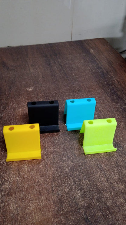 Wukusy multifunctional plastic mobile phone stand and pen holder in mixed colors, ideal for desk organization and device support.