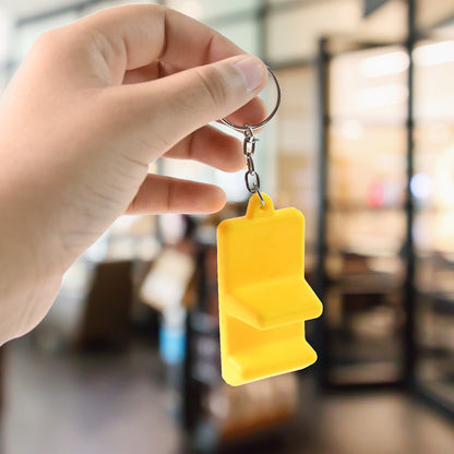 Wukusy plastic 2-in-1 mobile stand keychain showing compact design and keyring attachment for mobile accessories.