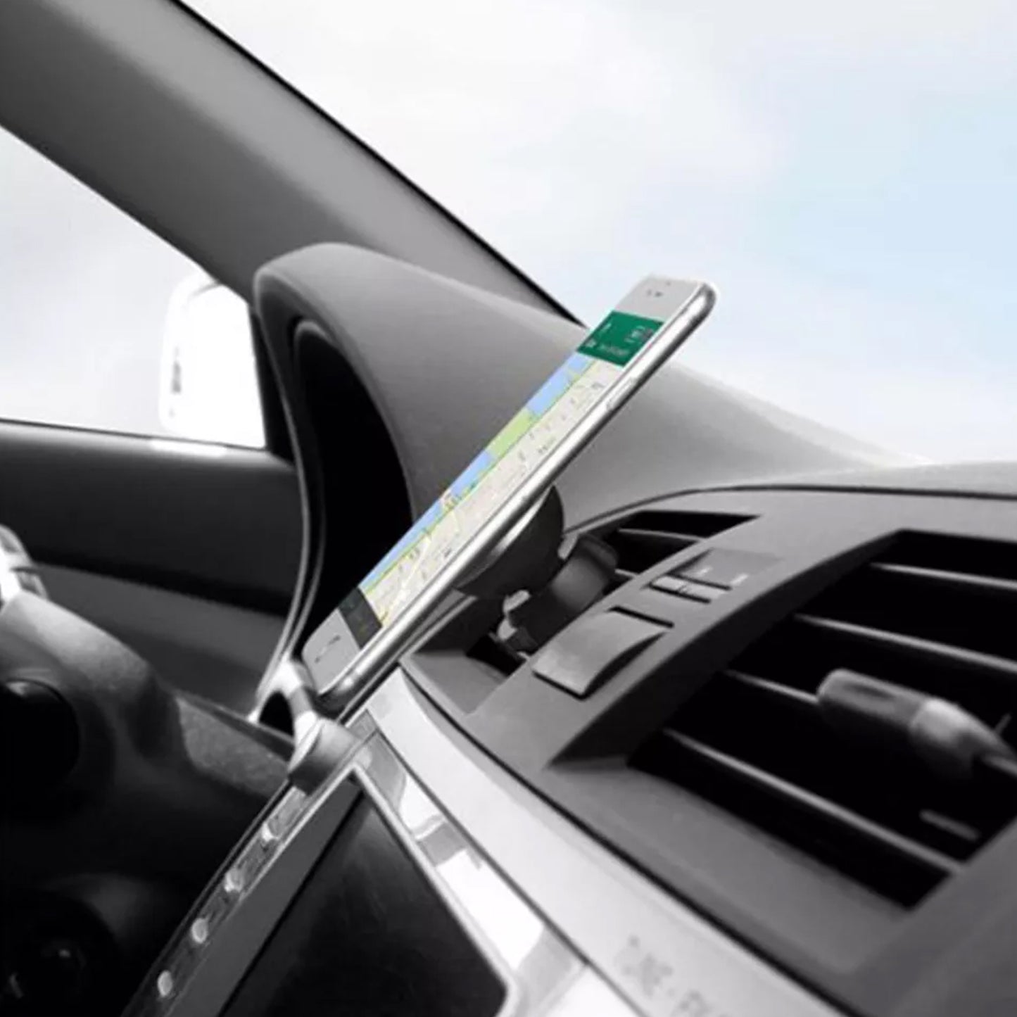Wukusy universal magnetic car mobile holder attached to a vehicle dashboard holding a smartphone securely.