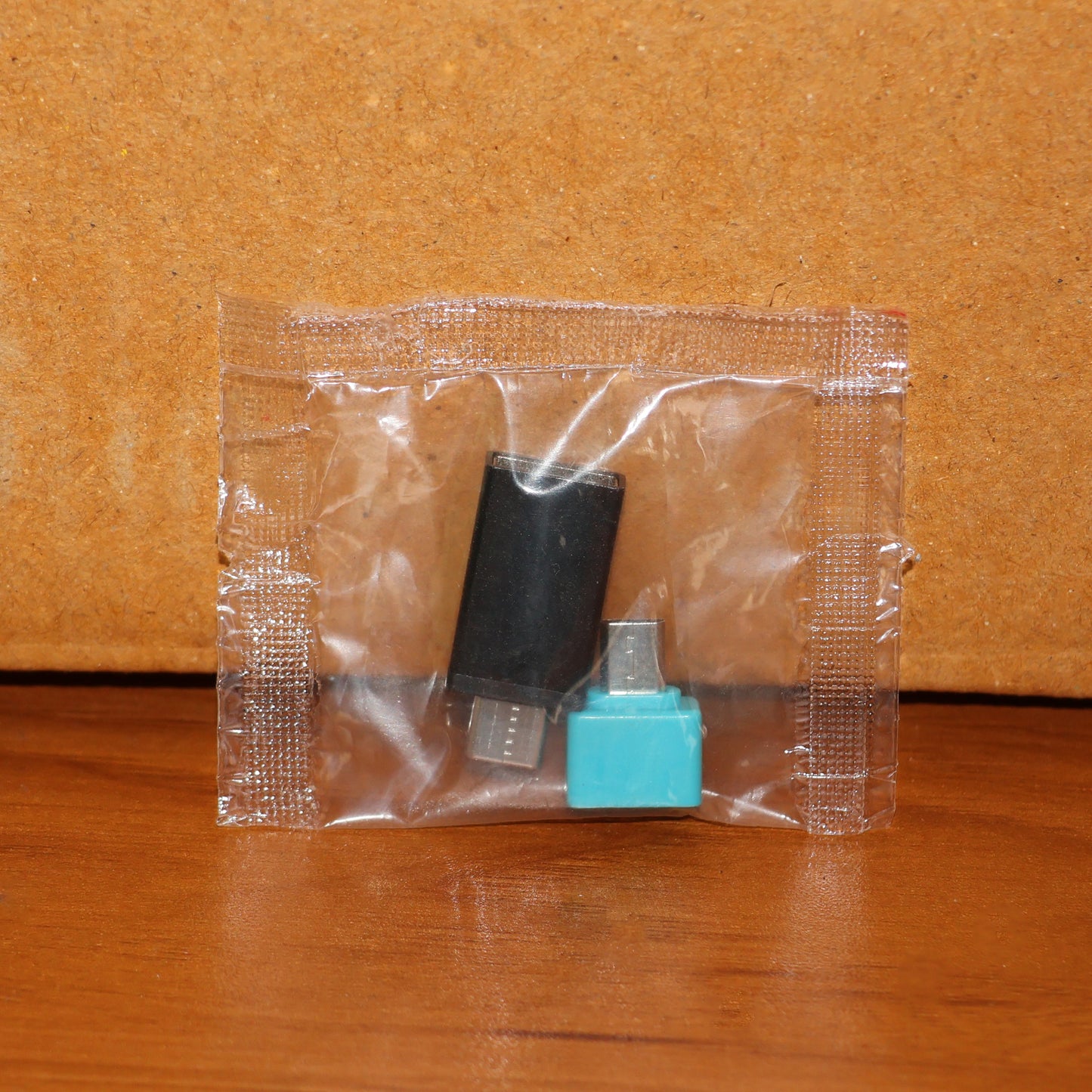 Wukusy USB Micro Type-C to USB-A OTG adapter set with two mobile accessories for connecting devices.