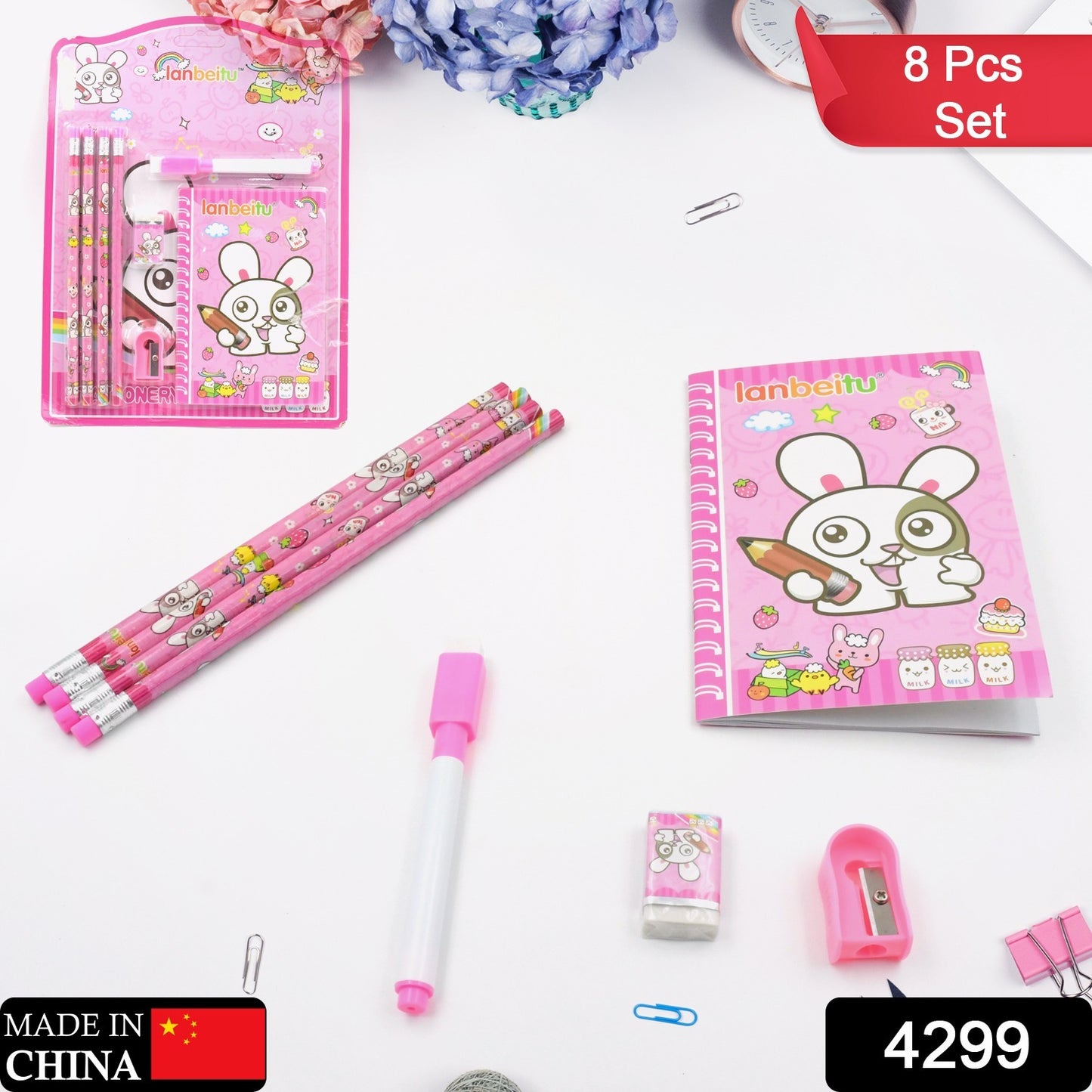 Wukusy 8-piece kids stationery set with wooden pencil sharpener, erasers, small diary, and school supplies for boys and girls.