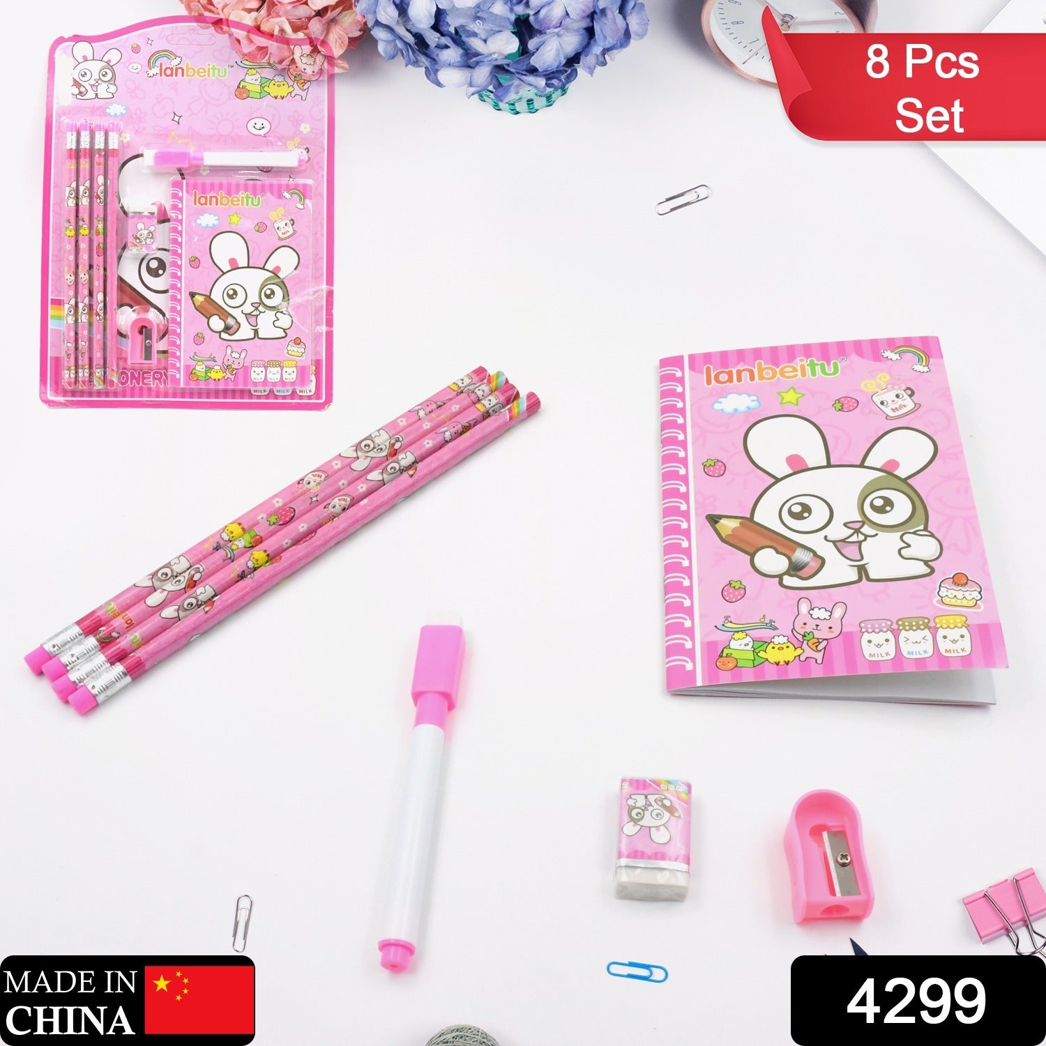 Wukusy 8-piece kids stationery set with wooden pencil sharpener, erasers, small diary, and school supplies for boys and girls.