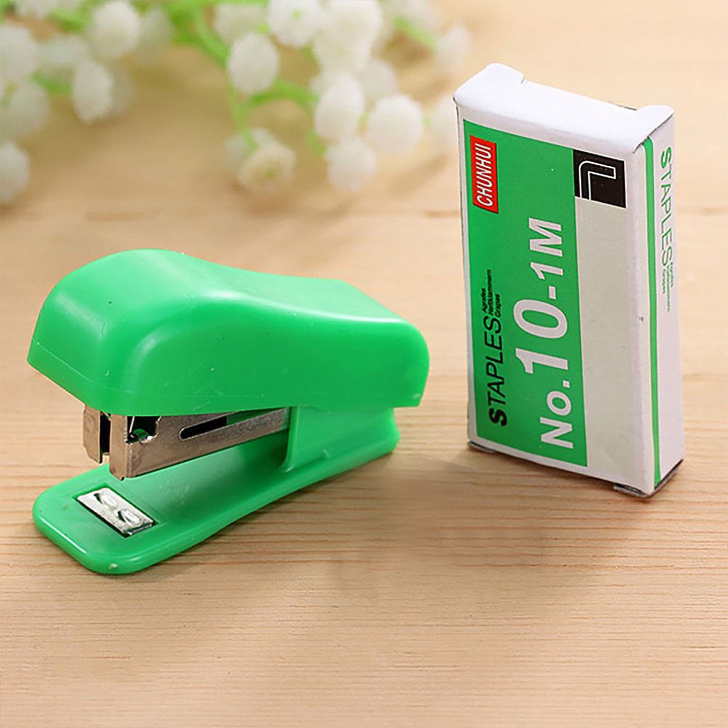 Wukusy office mini stapler with one strip of staples, compact and portable for quick document stapling.