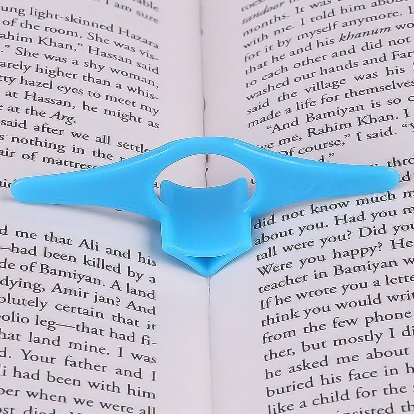 Wukusy office multi-function plastic thumb book support holder for holding pages during reading or studying.