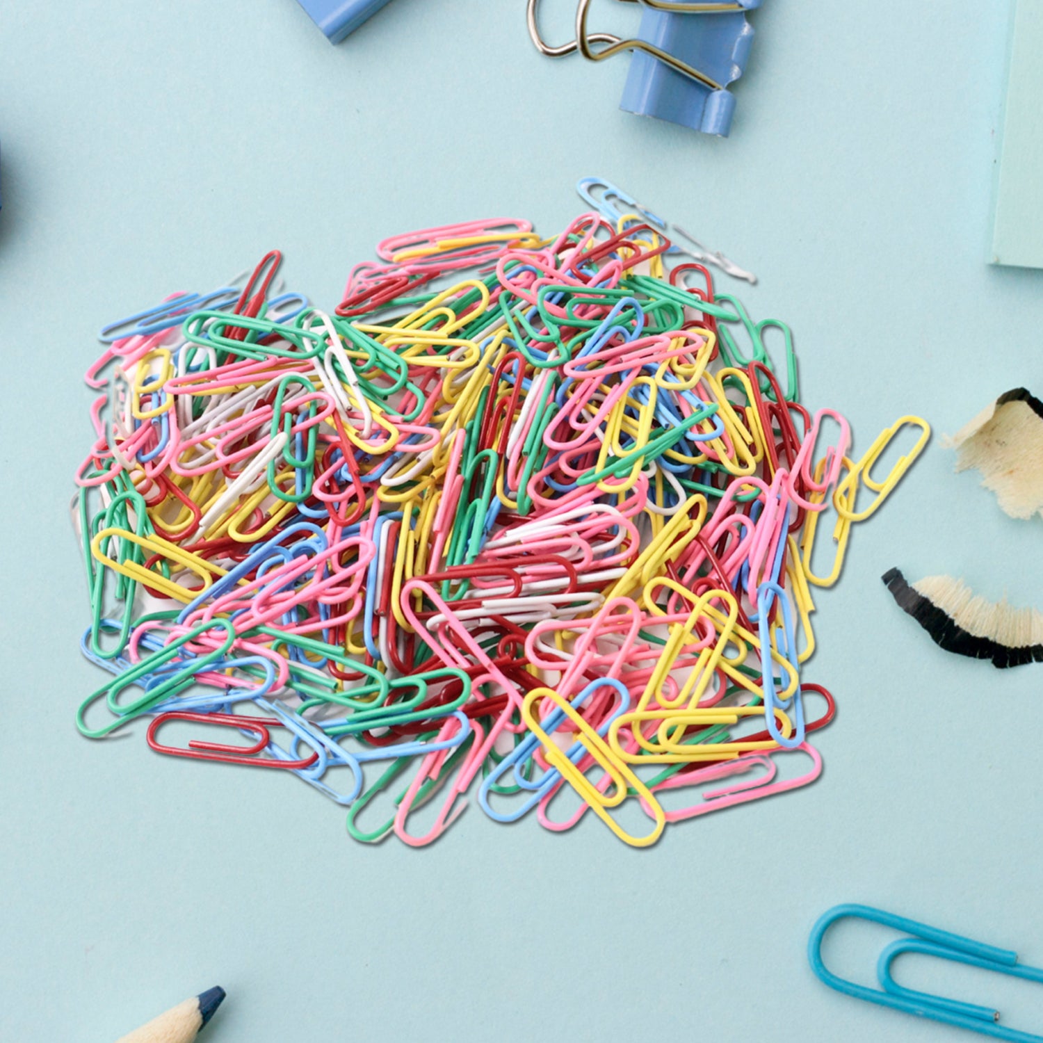Multicolor-coated paper clips from Wukusy office set, approximately 250 pieces, arranged in a pile on a white background.