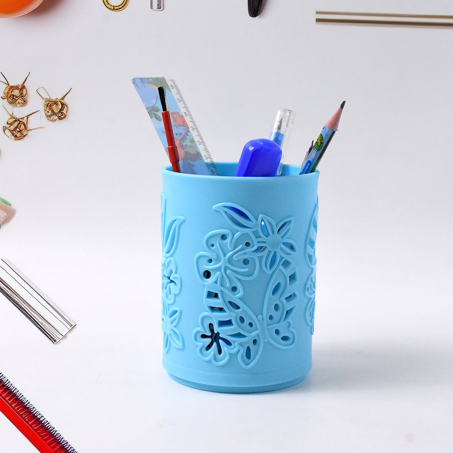 Wukusy plastic mesh pen holder on office desk, compact pen stand for organizing pens and stationery.