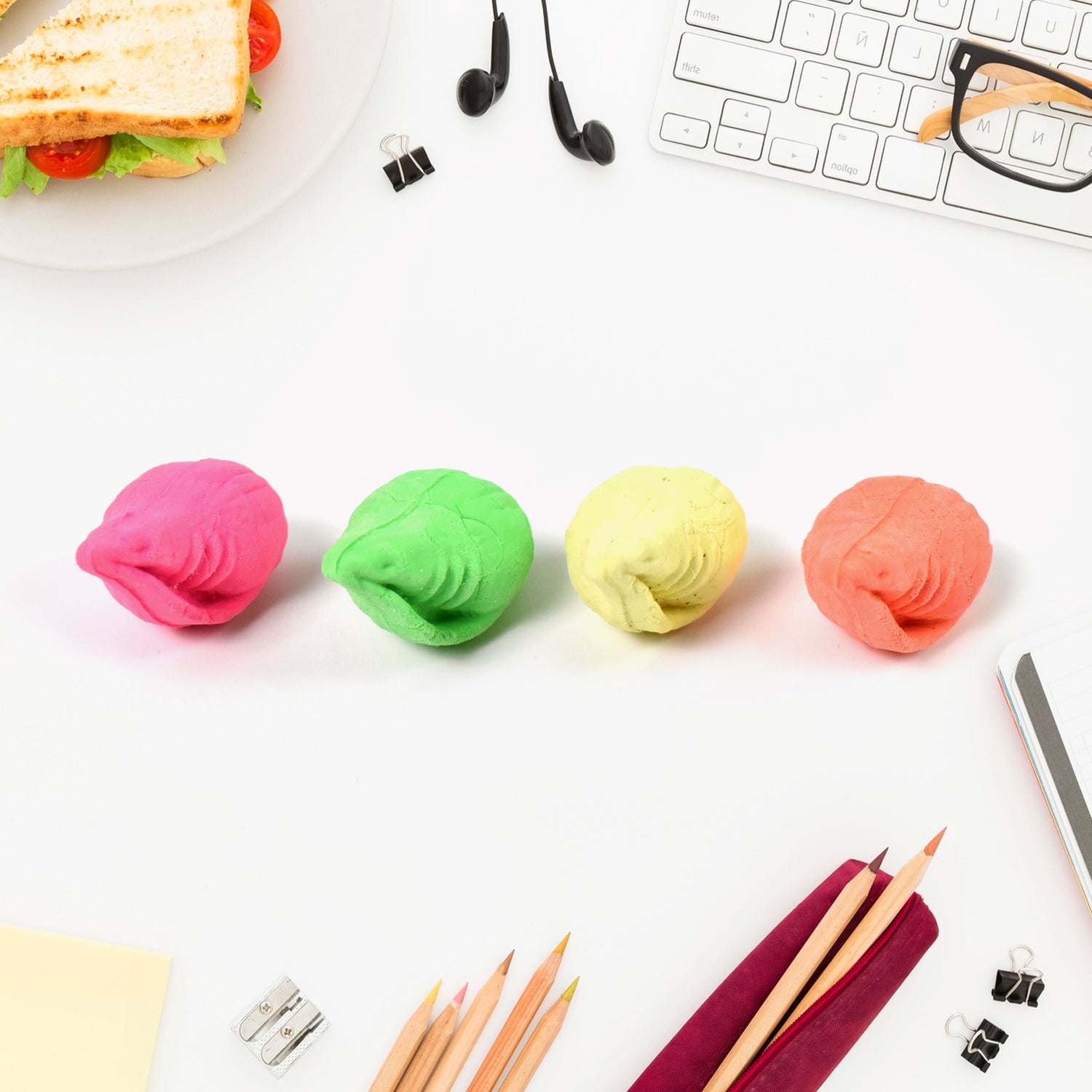 Wukusy shankh shape rubber eraser in mixed colors, ideal for office or school use, with a distinctive shell design.