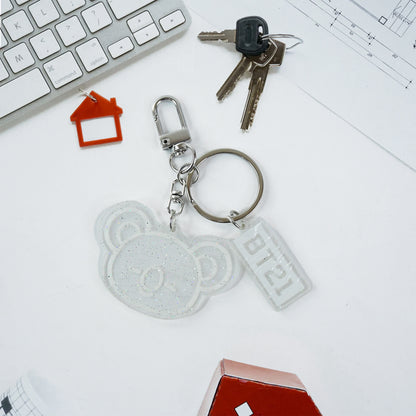 Cute acrylic and metal keychain from Wukusy with mixed design, featuring colorful and playful motifs on a keychain.