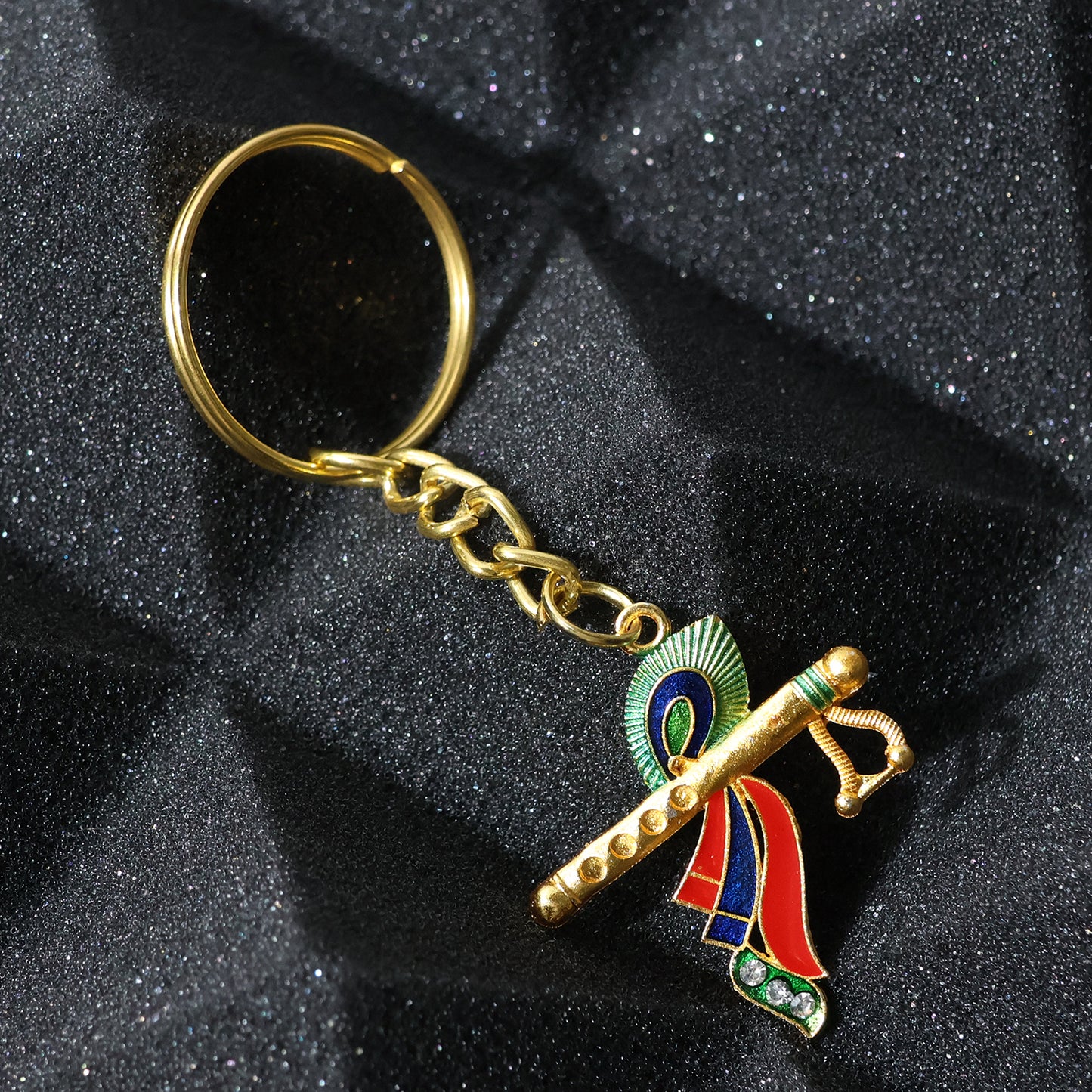 Wukusy Krishna flute keychain with intricate peacock feather design, showcasing detailed craftsmanship and vibrant colors.