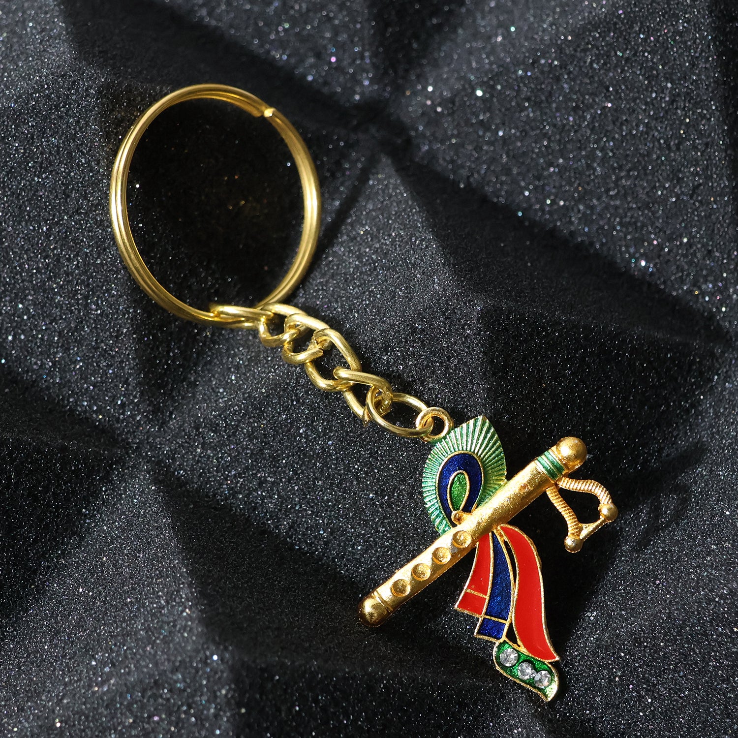 Wukusy Krishna flute keychain with intricate peacock feather design, showcasing detailed craftsmanship and vibrant colors.