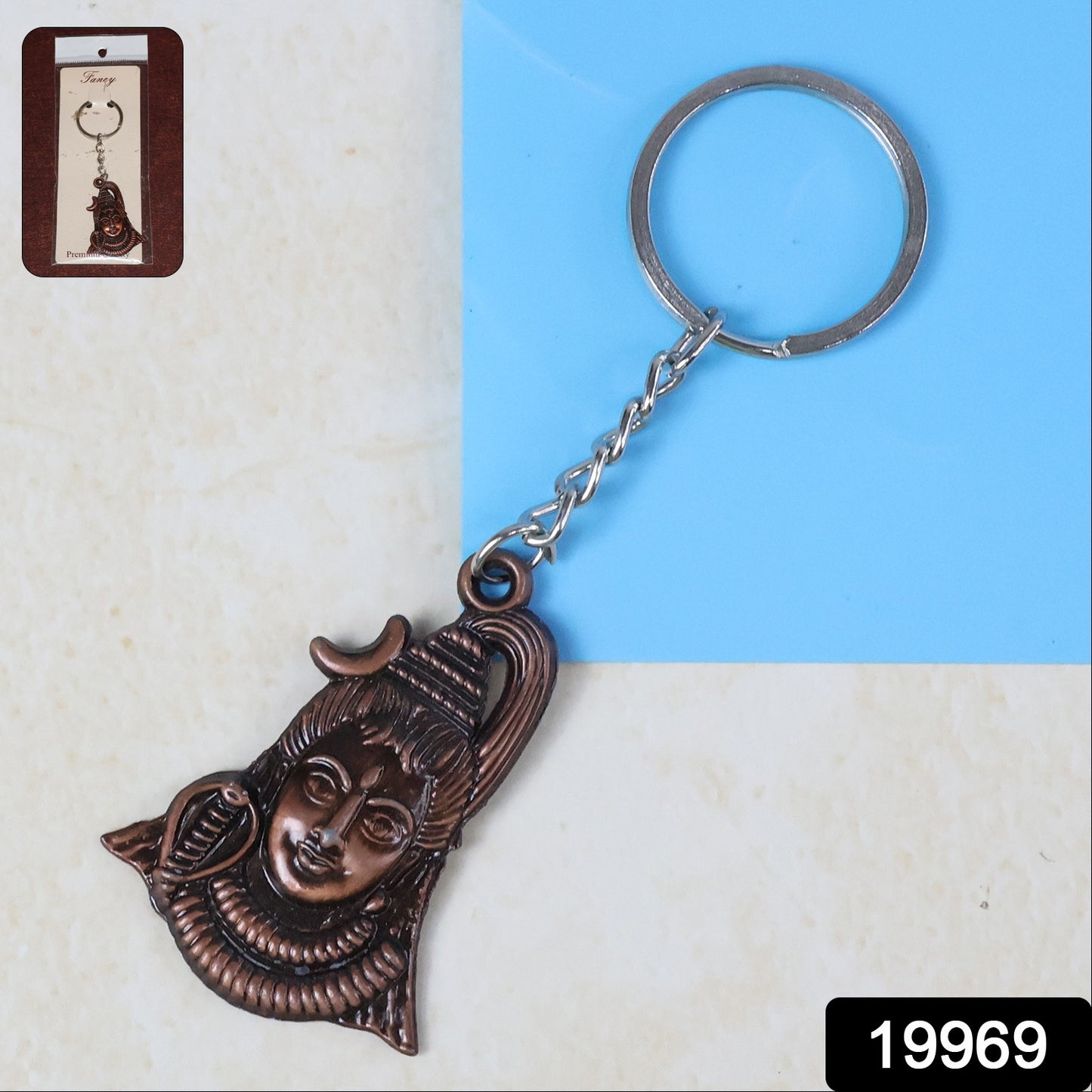 Antique finish Lord Shiva face keychain by Wukusy, featuring detailed deity design on a compact metal keychain.