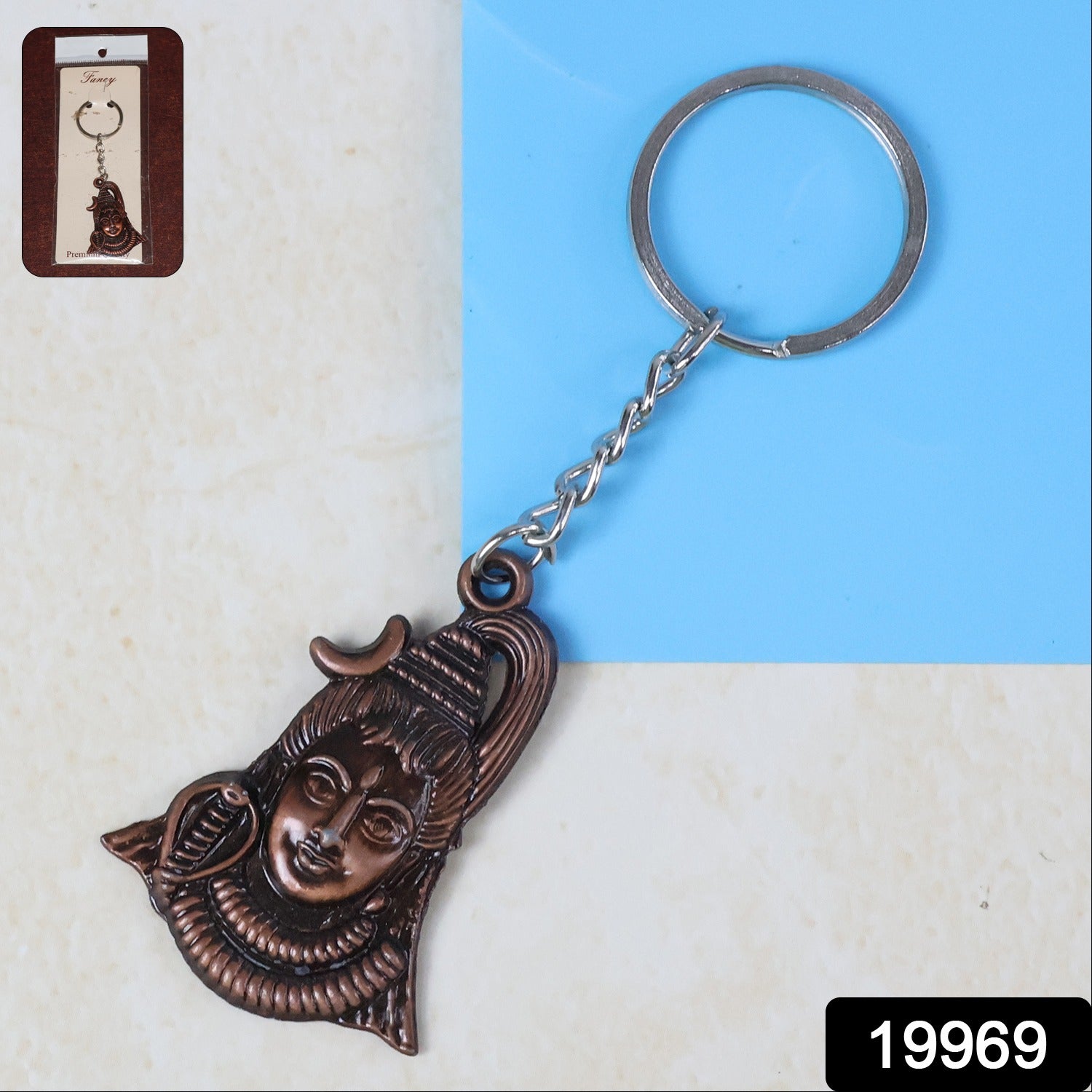 Antique finish Lord Shiva face keychain by Wukusy, featuring detailed deity design on a compact metal keychain.