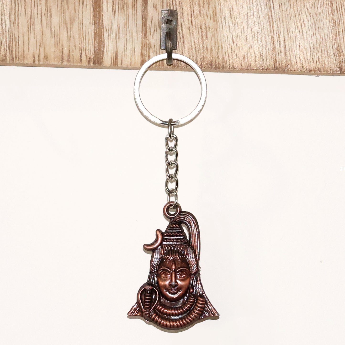 Lord Shiva face keychain with antique finish, featuring detailed sculpting, from Wukusy's collection of decorative products.
