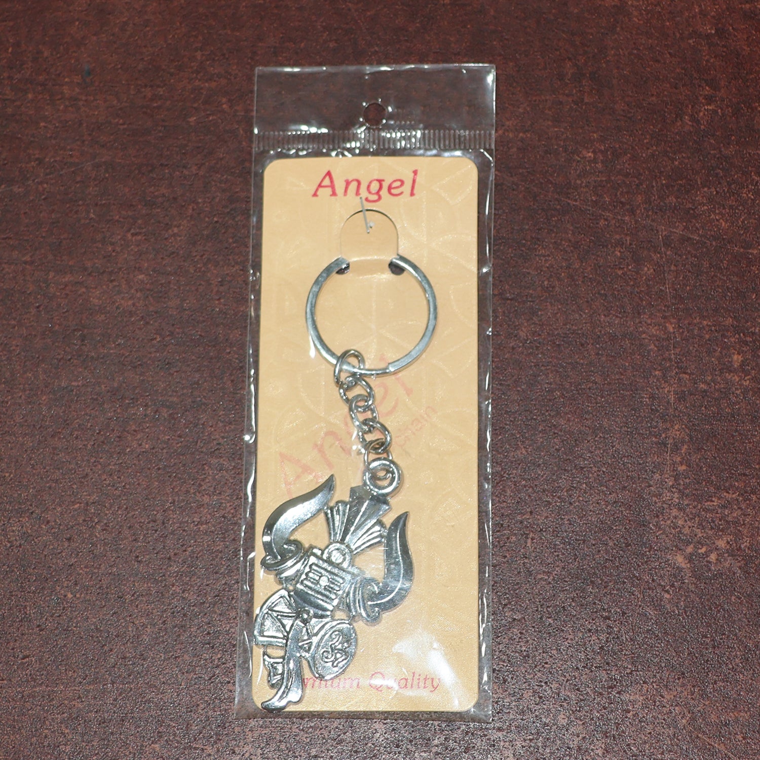 Silver keychain featuring Trishul, Damru, and Shiv symbol by Wukusy, crafted for spiritual symbolism and everyday use.