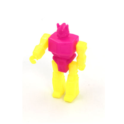Small robot toy by Wukusy, featuring a colorful plastic design with movable arms and a friendly robot face.