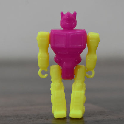 Small Wukusy robot toy, colorful plastic robot figure with movable arms and legs, perfect for kids' play and collection.