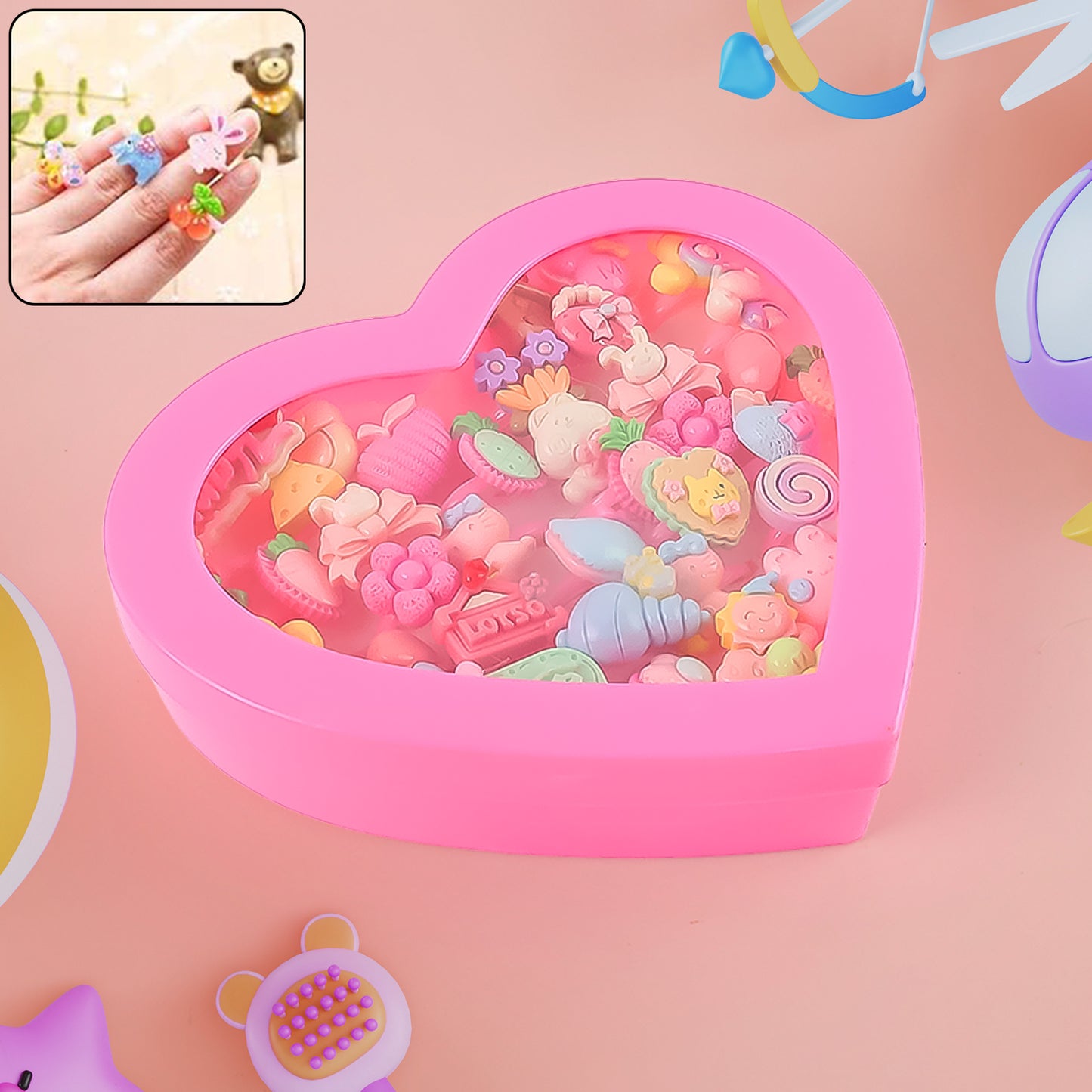 Set of 35 playful decorative rings for children by Wukusy in a heart-shaped storage box, featuring colorful, toy-style designs.
