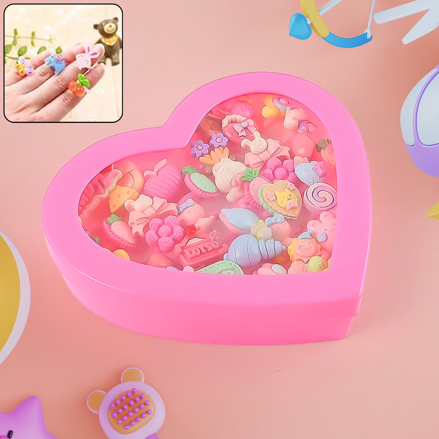 Set of 35 playful decorative rings for children by Wukusy in a heart-shaped storage box, featuring colorful, toy-style designs.