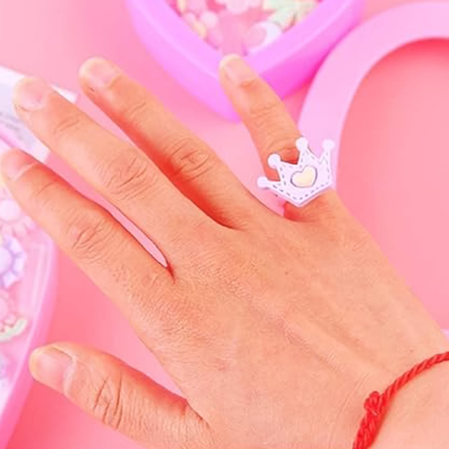 Set of 35 playful decorative rings for children by Wukusy in a heart-shaped storage box, colorful and fun toy jewelry for kids.