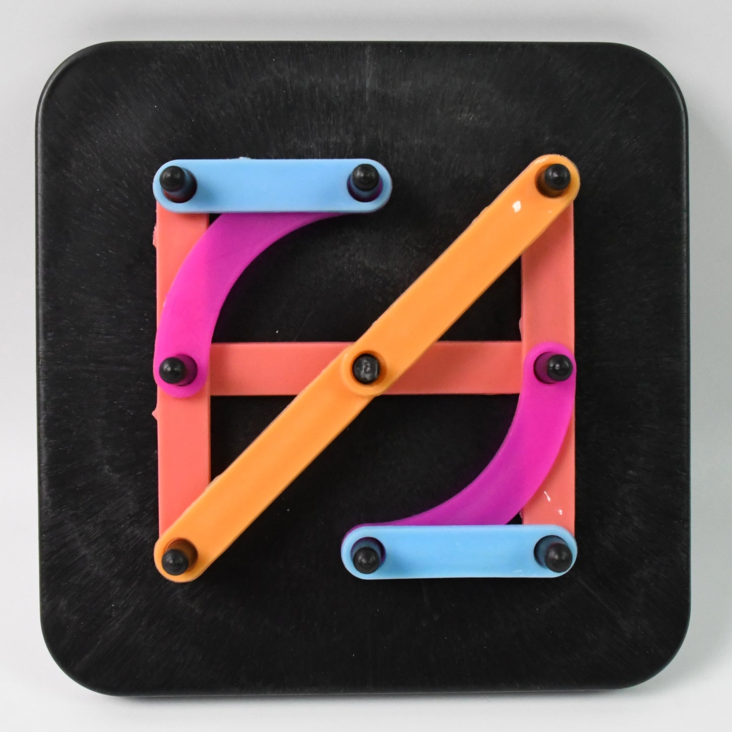 Wukusy alphabet construction puzzle with colorful alpha-numeric pieces for kids' educational toy and motor skills development.